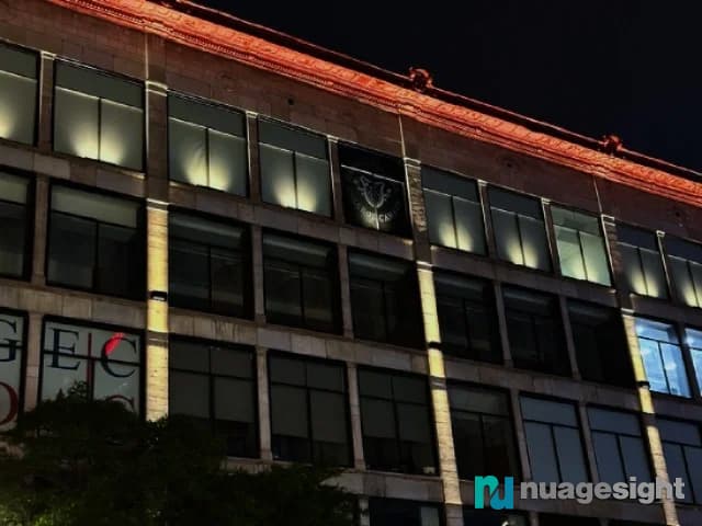Side view of large buildings lighting at night