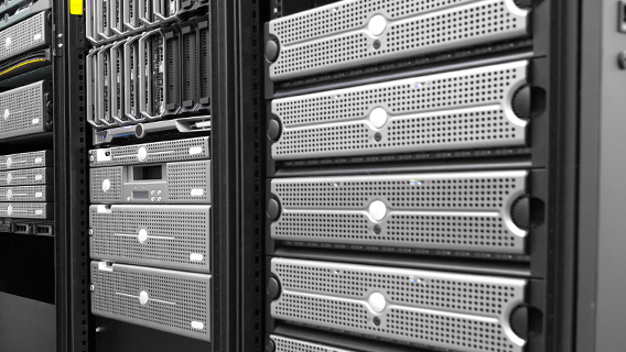 Multiple cloud servers stacked on top of one another in a rack in a datacenter.